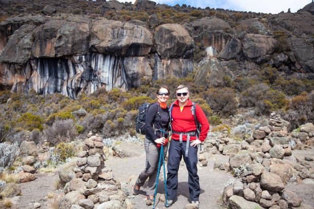 Couple backpackers on the trek to Kilimanjaro mountain.