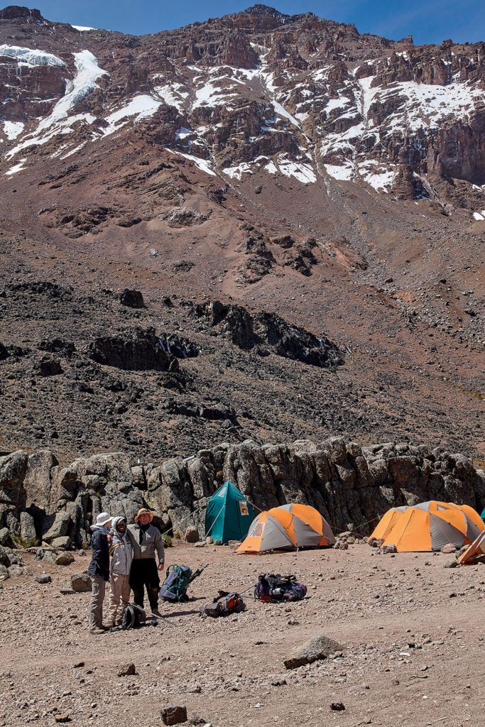 Kilimanjaro hikers next to their camps