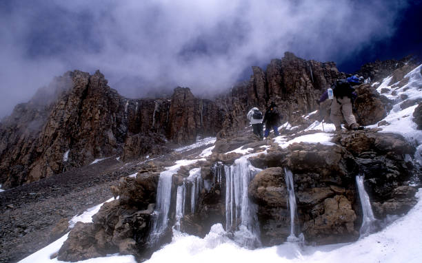 Climbers ascend the icy, outer wall of Kibo crater en route to the summit of Mt. Kilimanjaro in Tanzania, Africa with experts from Kilimanjaro Rwenzori.